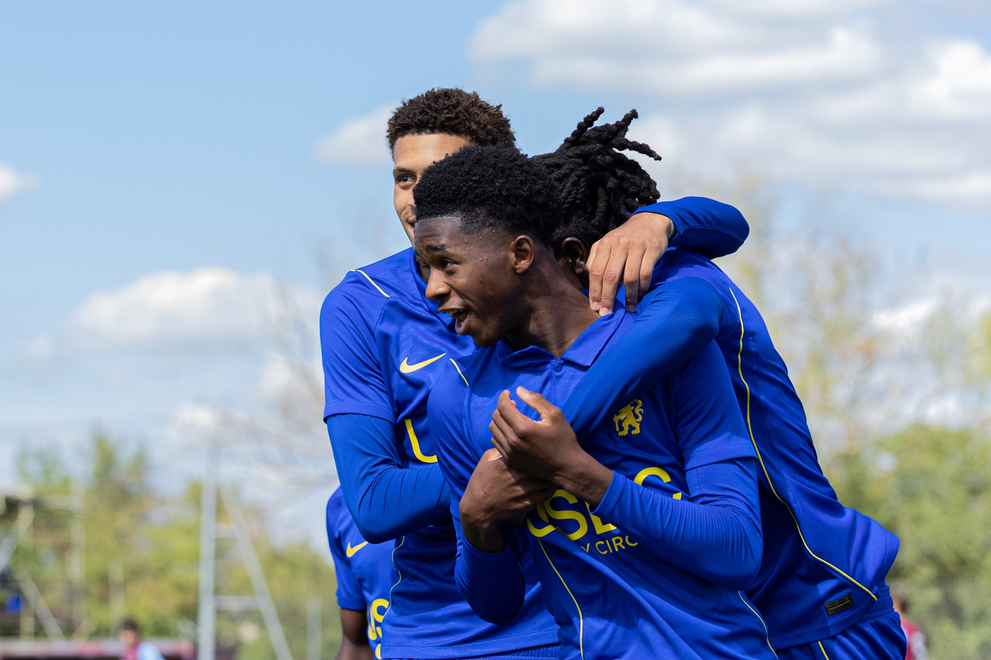 Chelsea players hugging in celebration