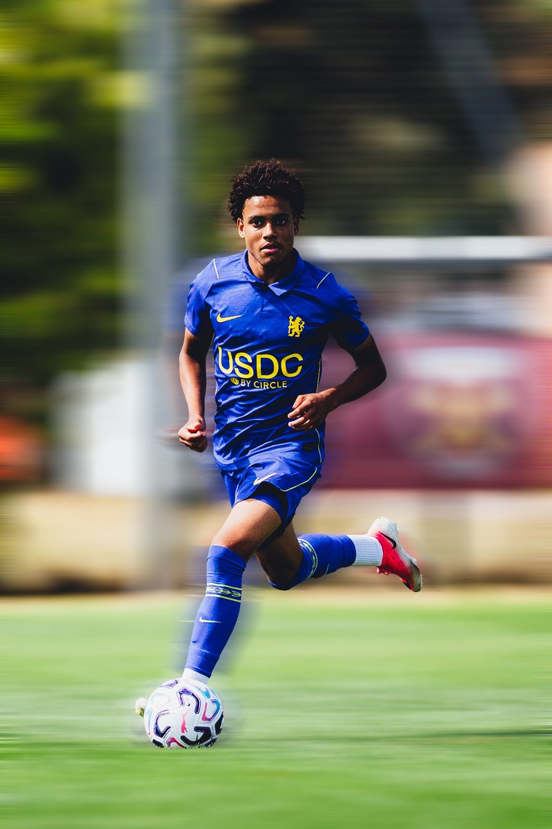 Chelsea player running with the ball, motion blur edit