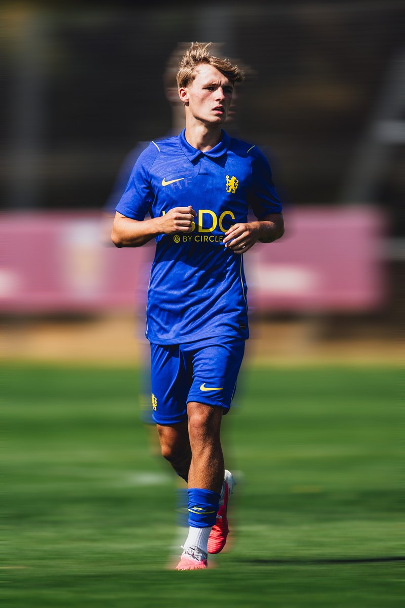 Chelsea player jogging, motion blur edit
