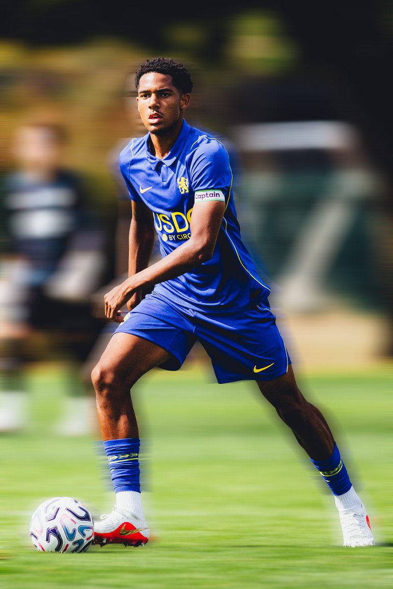 Chelsea player running with the ball, motion blur edit